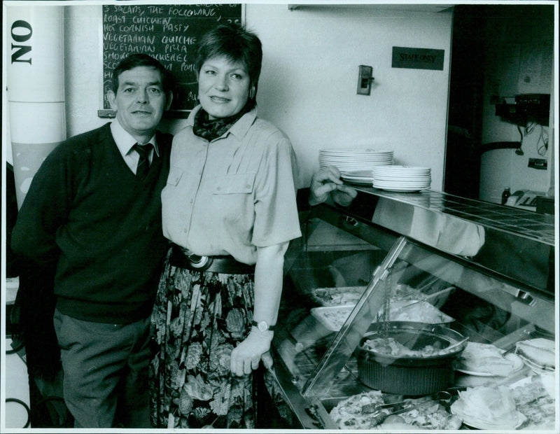 Landlord Roger Smith, cook Rotraud Palmer, and staff of the Old Tom, St Aldates, Oxford, taste test a variety of dishes. - Vintage Photograph