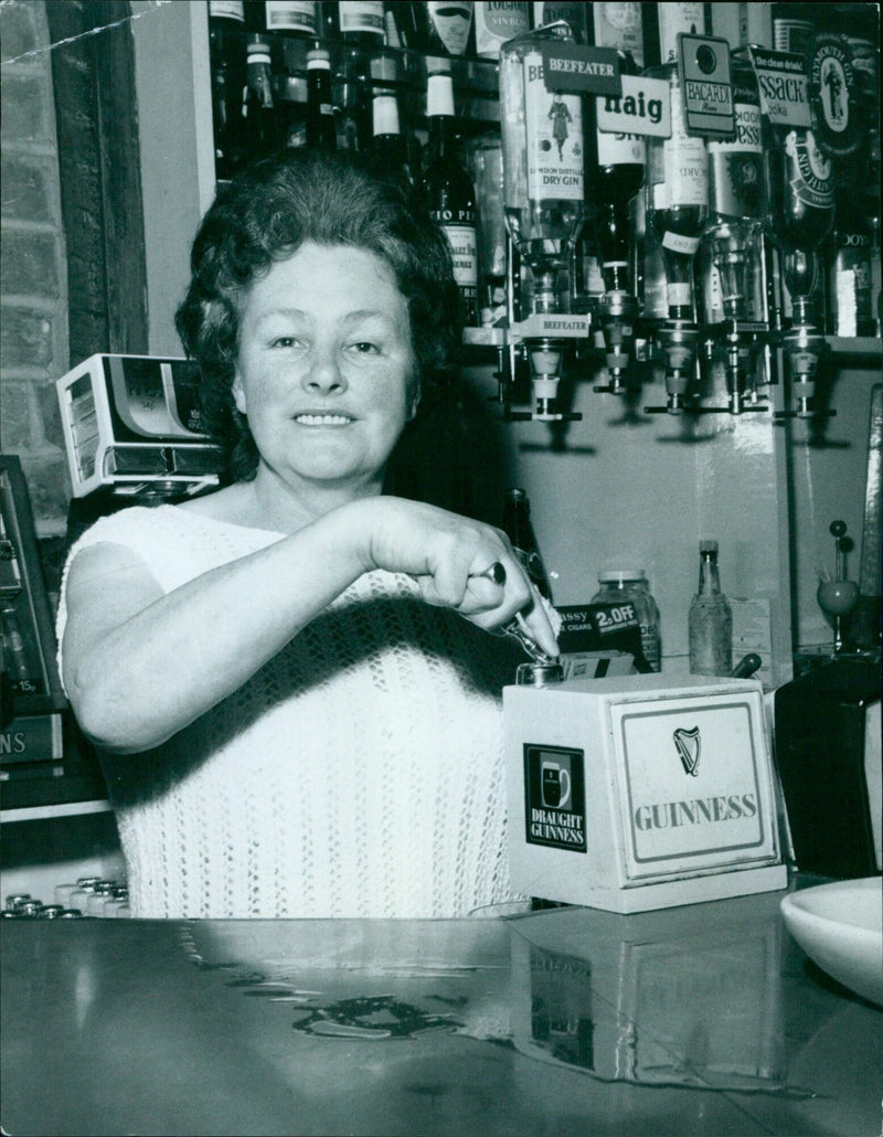 A man drinking a pint of Guinness at the Bulldog pub in Oxford. - Vintage Photograph