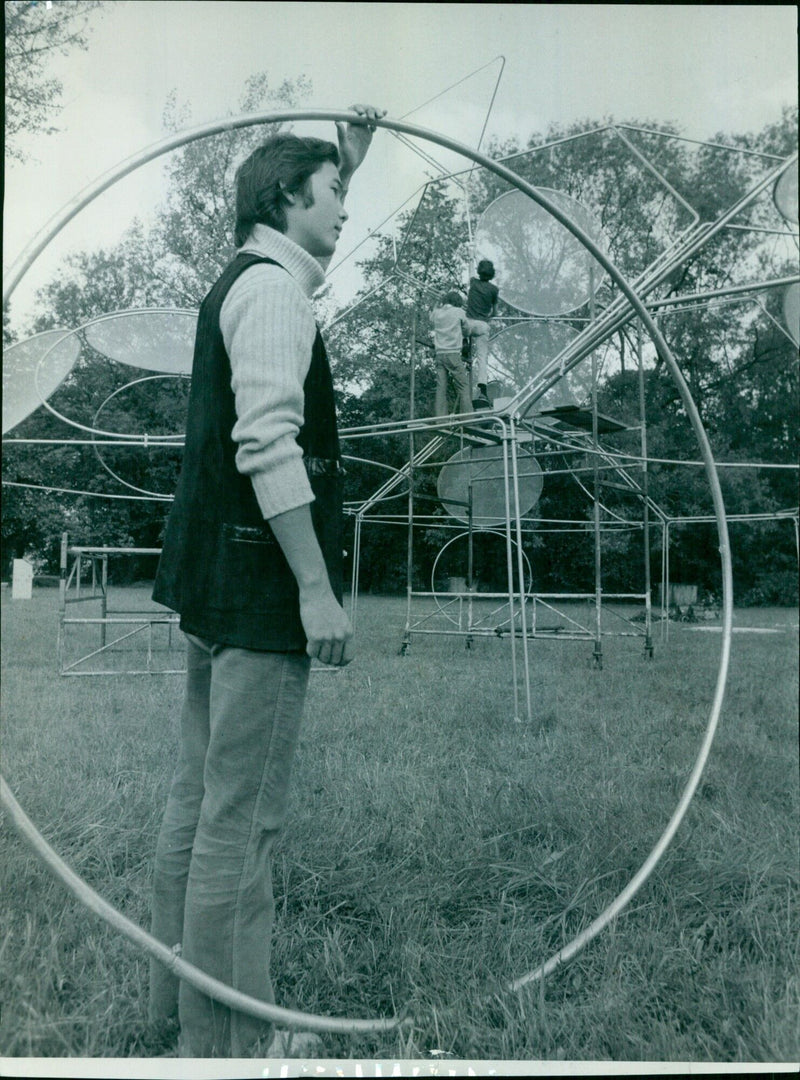 Paul de Gaiffier d'Hestroy assisting in the setup of Everyman production in St. Hilda's College Meadow. - Vintage Photograph