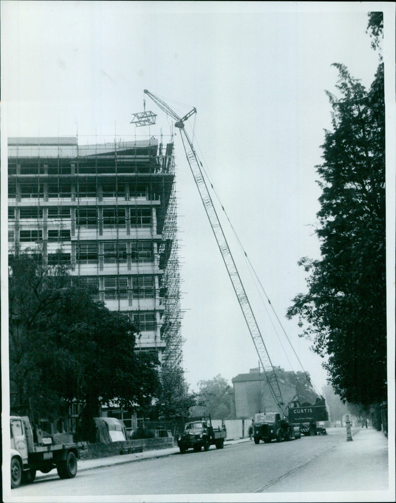 Pieces of a dismantled tower crane are lowered to the ground at Banbury Road. - Vintage Photograph