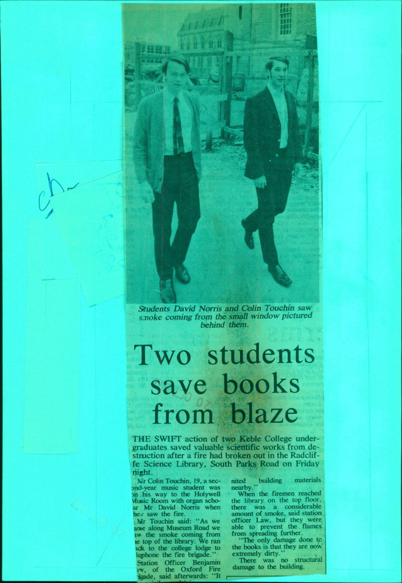 Two students save books from blaze in Oxford Fire Brigade rescue. - Vintage Photograph