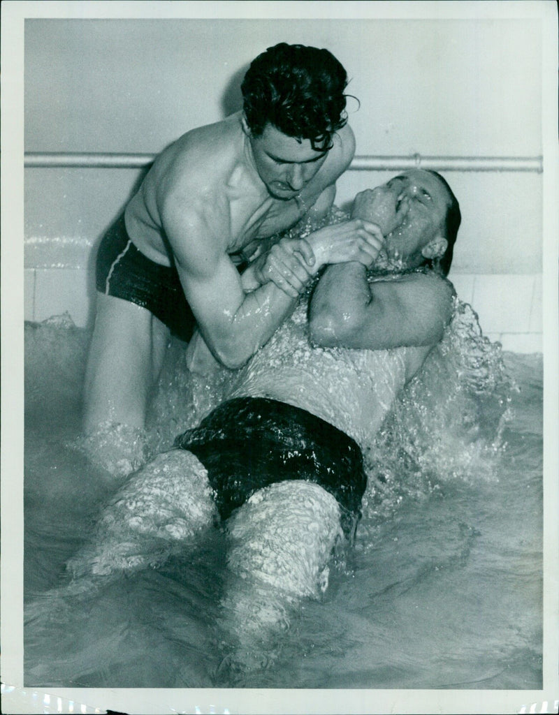 A man and woman are baptized during a Sunday matronen at a small chapel in Innersid, Oxford. - Vintage Photograph