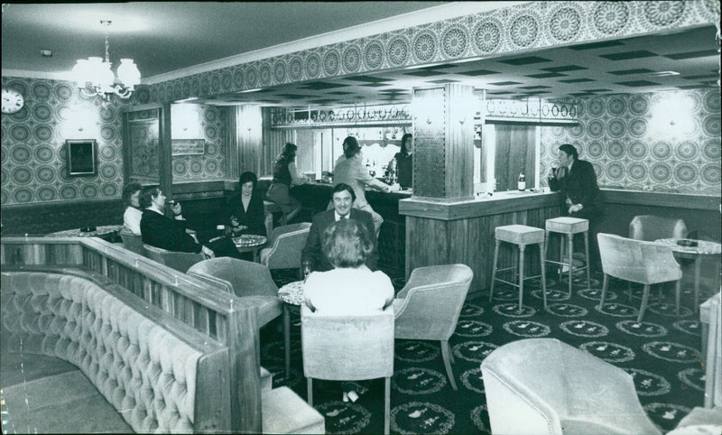 People stand in line to buy lottery tickets at a newsstand. - Vintage Photograph