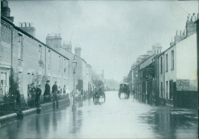 Floodwaters inundate Lake Street in Oxford on June 3, 1985. - Vintage Photograph