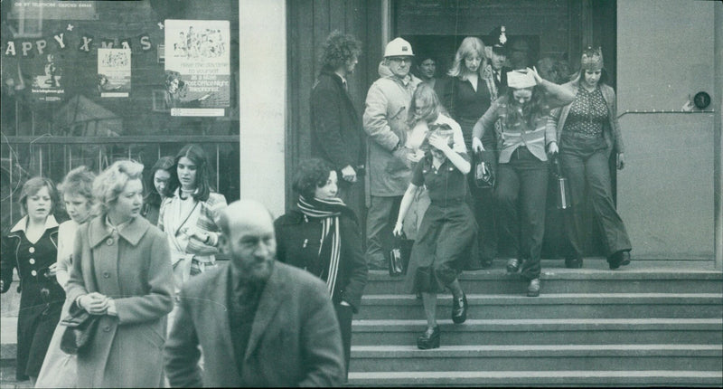 Post Office night telephonists clear out of the Oxford Telephone Exchange after a hoax bomb tip-off. - Vintage Photograph