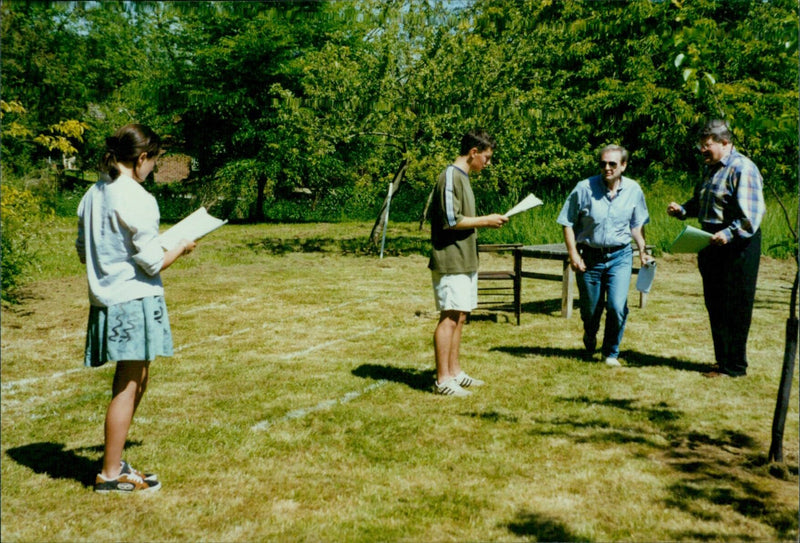 From left to right, cast members Amy Shields, James Turpin, Dave Carie, and Richard Digby Day pose for a photograph. - Vintage Photograph