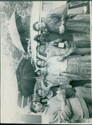 A man carrying a Volkswagen 517 model car in the city of Seoul. - Vintage Photograph