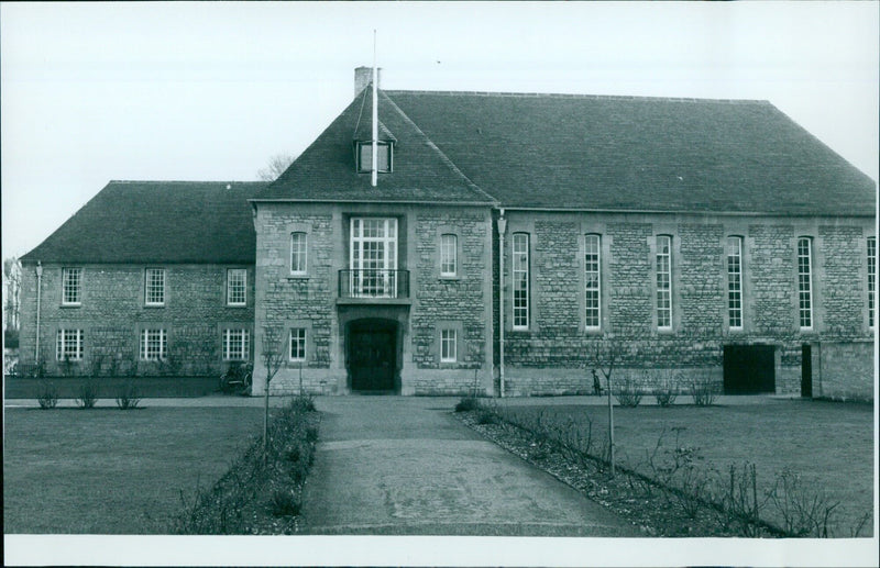 Students walk across the grounds of Linacre College at St Aldates in Oxford, England. - Vintage Photograph