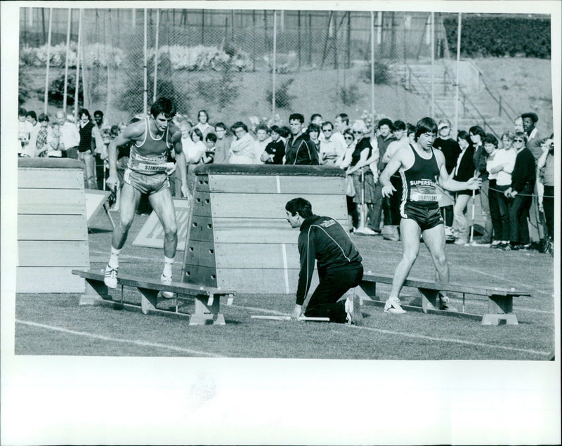 Basketball player Paul Stimpson and skier Konrad Bartelski compete in the Supersta obstacle course. - Vintage Photograph