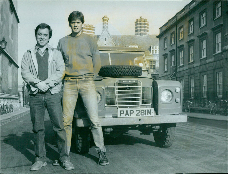 A Land Rover is seen surrounded by people on February 17, 1984 in Ampeix, France. - Vintage Photograph