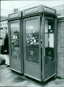 Two telephone booths outside of Oxford Railway Station with wet paint. - Vintage Photograph