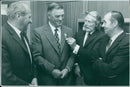 Mr. John L. Wilson is congratulated by his colleagues after receiving a presentation from Telephone Manager Mr. PE Buck. - Vintage Photograph