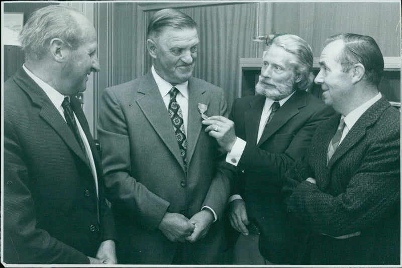 Mr. John L. Wilson is congratulated by his colleagues after receiving a presentation from Telephone Manager Mr. PE Buck. - Vintage Photograph