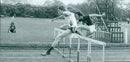 Axel Salmander leads Richard Waple during the IIO(B) Hurdles event at the Cuppers Finals. - Vintage Photograph