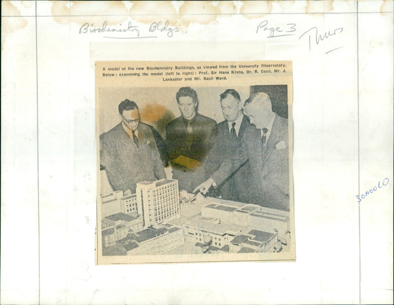 Academics and researchers examine a model of the new Biochemistry Buildings. - Vintage Photograph