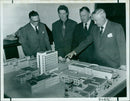 Academics and researchers examine a model of the new Biochemistry Buildings. - Vintage Photograph