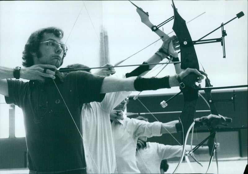 University archers practice in the university gym. - Vintage Photograph