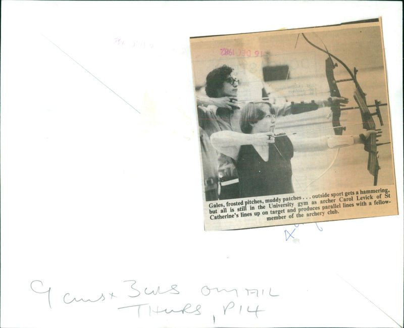 Archer Carol Levick takes aim in the University gym. - Vintage Photograph