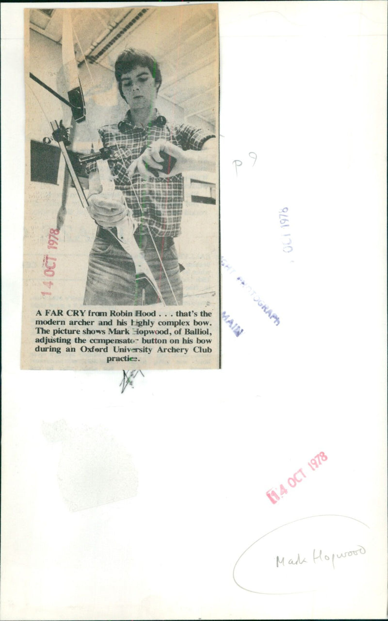 Mark Hopwood of Balliol adjusts the compensator button on his bow during an Oxford University Archery Club practice. - Vintage Photograph