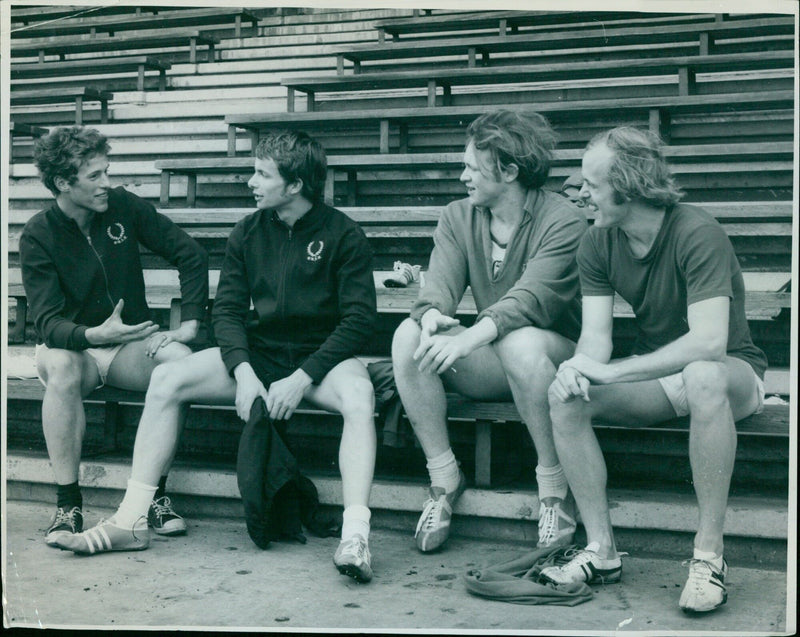 Oxford University's athletic team discussing their prospects for the upcoming match against Cambridge. - Vintage Photograph