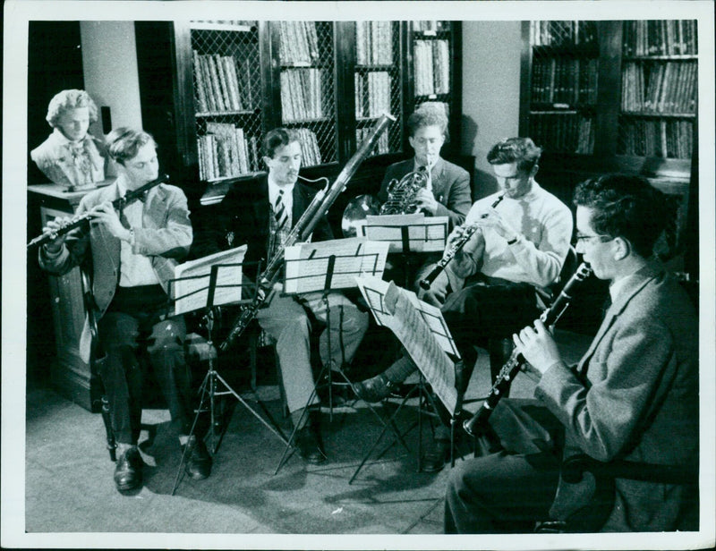 Students from Oxford University enjoy making music together. - Vintage Photograph