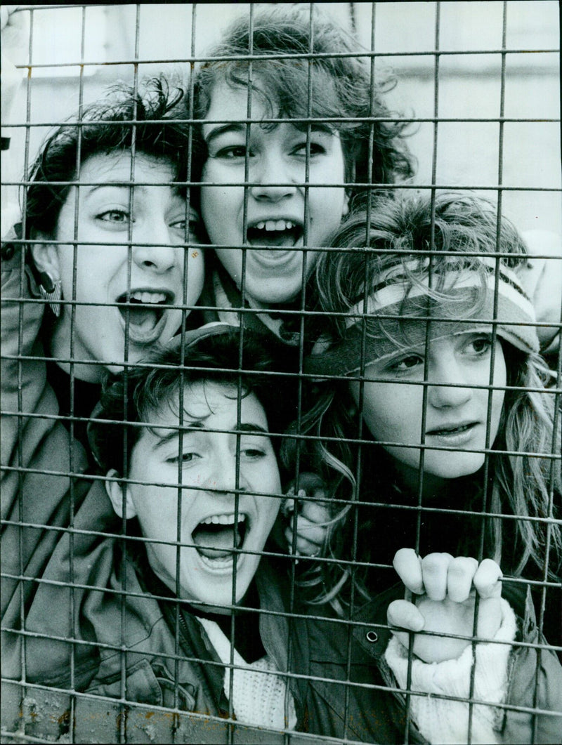 Soccer-mad students gather in anticipation of the opening night of the University stage play Red Devils. - Vintage Photograph