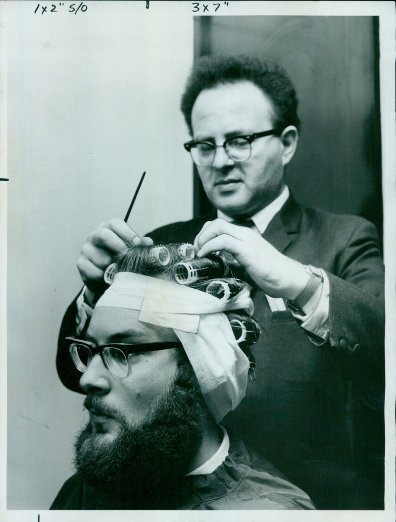 Wadham College undergraduate, Adrian Benjamin, has his hair and beard styled for a musical revue. - Vintage Photograph