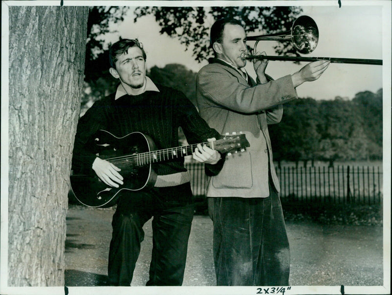 Two Brasenose College students playing music in Christ Church Meadow. - Vintage Photograph