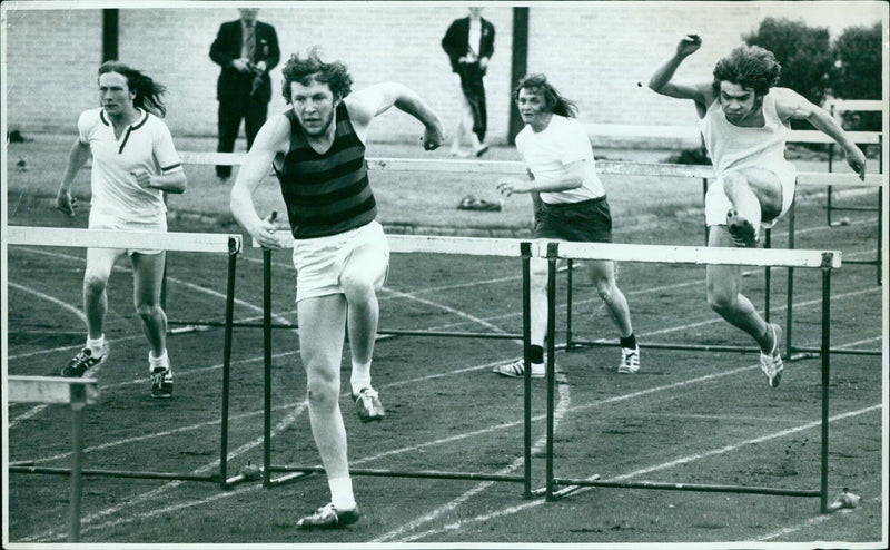 Bryan Bowers competes in the hurdles during the Cupperb Final at Iffley Rd. - Vintage Photograph