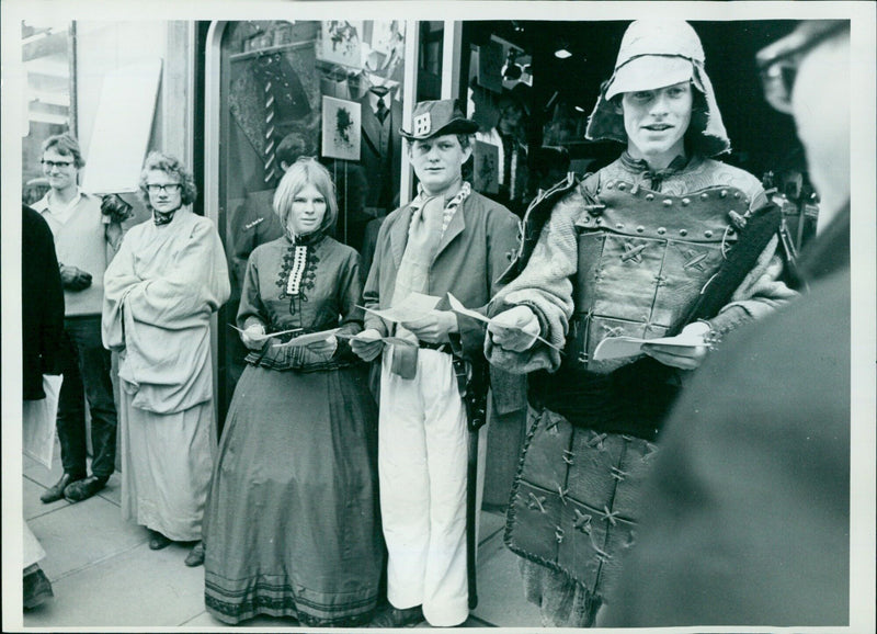 Members of an Oxford theatre group hand out leaflets in High Street, Oxford. - Vintage Photograph