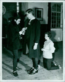 Eddie Gilbert, Patricia Dever, Brian Terrys, and Father Walter attend the S.U. Experimental Mala in St.Edund Haly. - Vintage Photograph