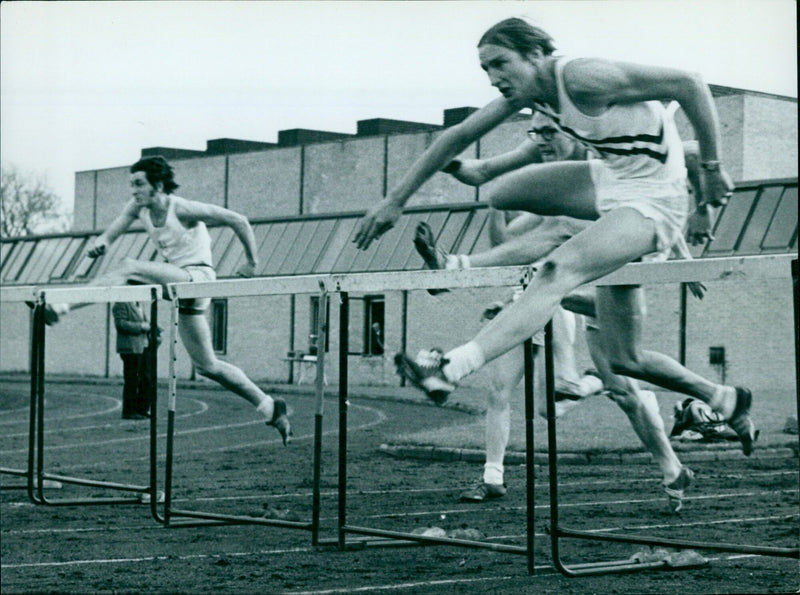 A. Pascoe of the British Railways Central Athletic Club wins the 120 yards hurdles event during the Oxford University Athletics Club event at Iffley Road Track. - Vintage Photograph