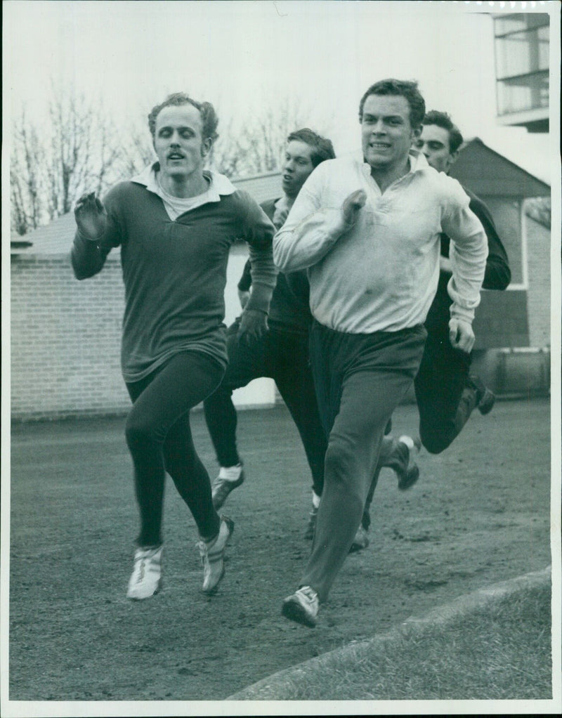 Students from four colleges run on the Ffley Road running track in Oxford, England. - Vintage Photograph