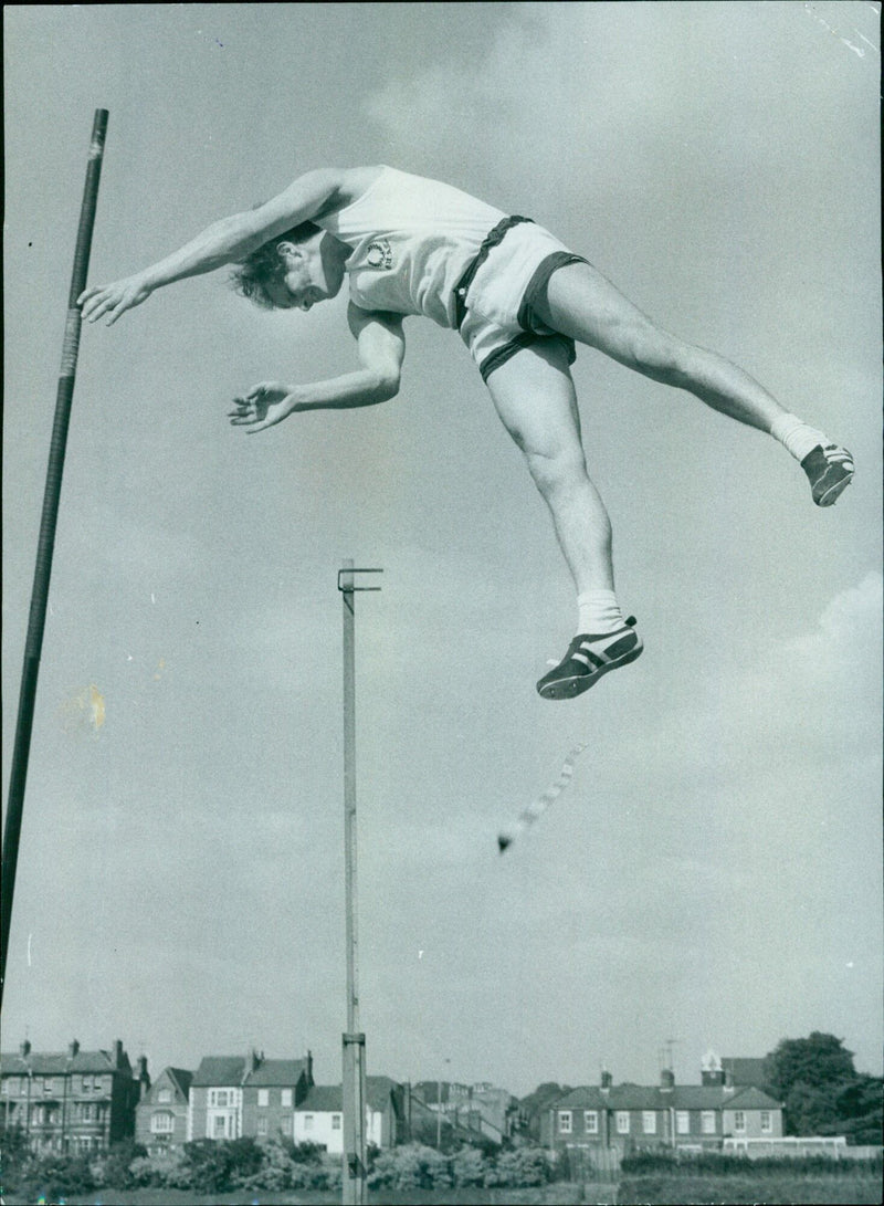 Oxford University pole vaulter Peter Edwards fails to clear the bar at 12ft. - Vintage Photograph