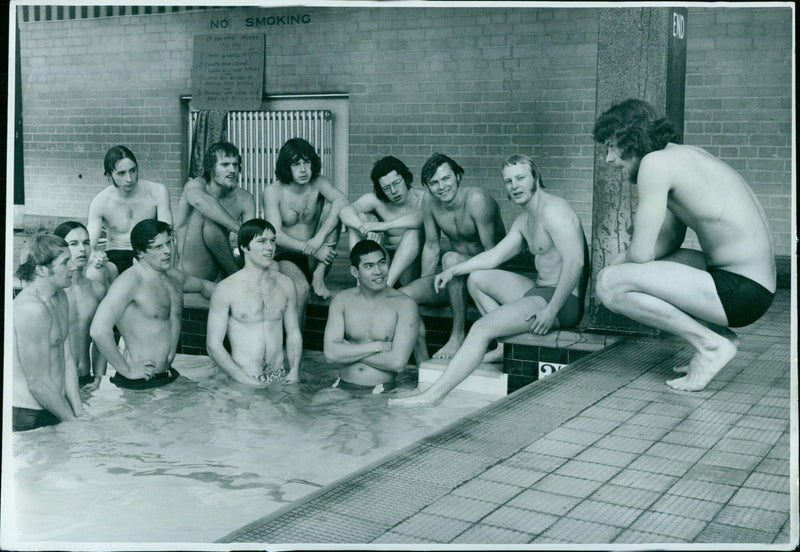 Swimmers taking a break in the pool. - Vintage Photograph
