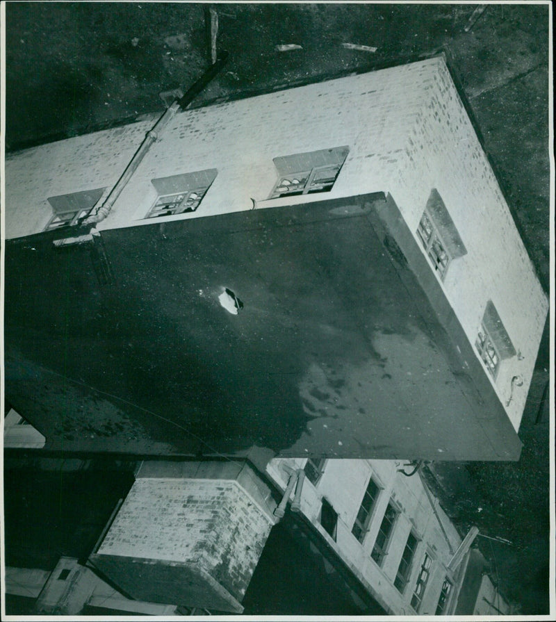 The roof of the Irish Club damaged by an explosion. - Vintage Photograph