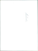 A mountain biker rides down a steep, rocky trail. - Vintage Photograph