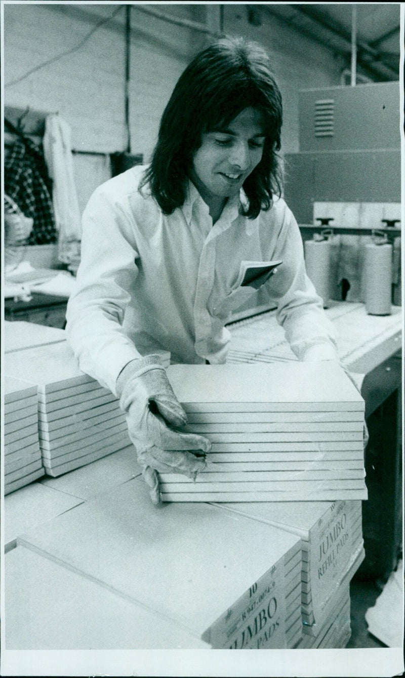 Chris Shane operates a shrink wrapping machine at Hunt & Broadhurst. - Vintage Photograph