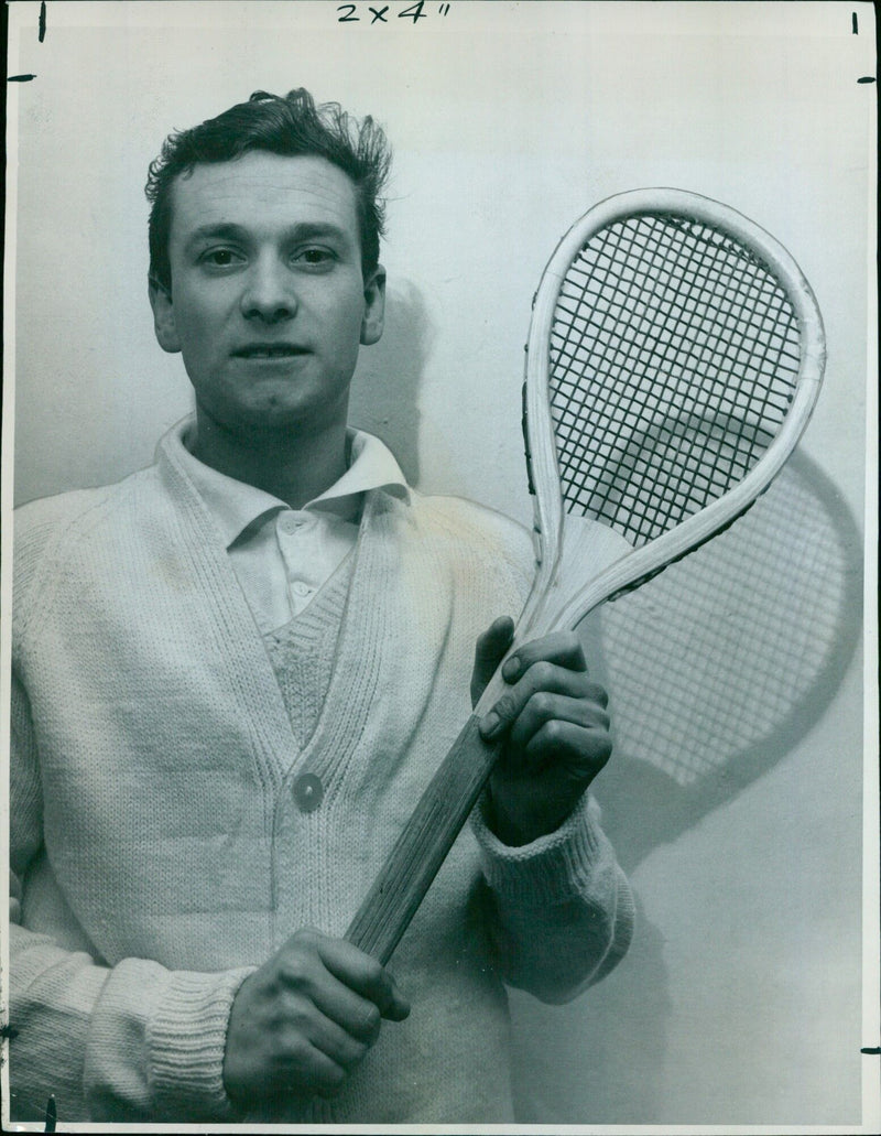 Peter Dawes, the professional of the University Tennis Club, tends to one of the rackets used in the ancient game that has been played in Oxford for over 350 years. - Vintage Photograph