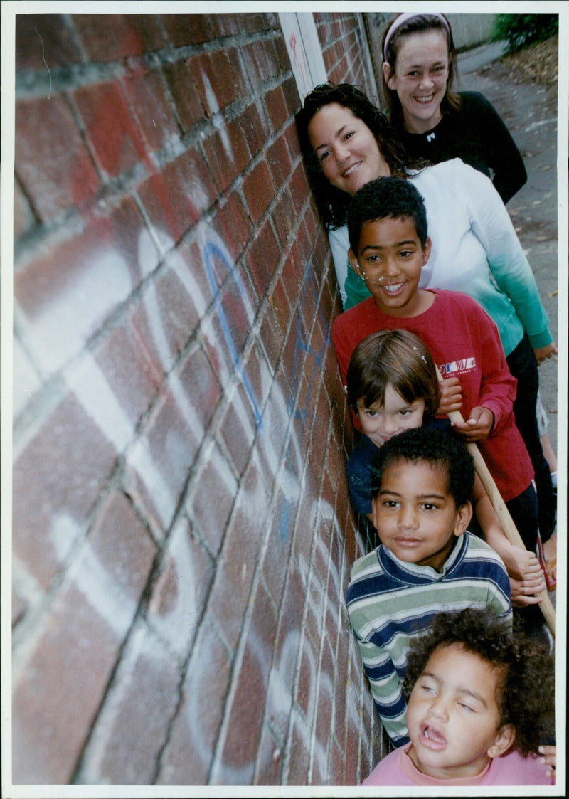 Residents of Cardigan Street, Jericho, clean up an alleyway behind their homes. - Vintage Photograph