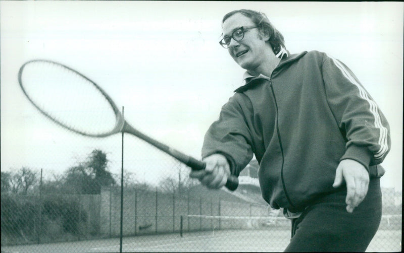 Tennis enthusiasts practice at Iffley Road despite cold weather. - Vintage Photograph