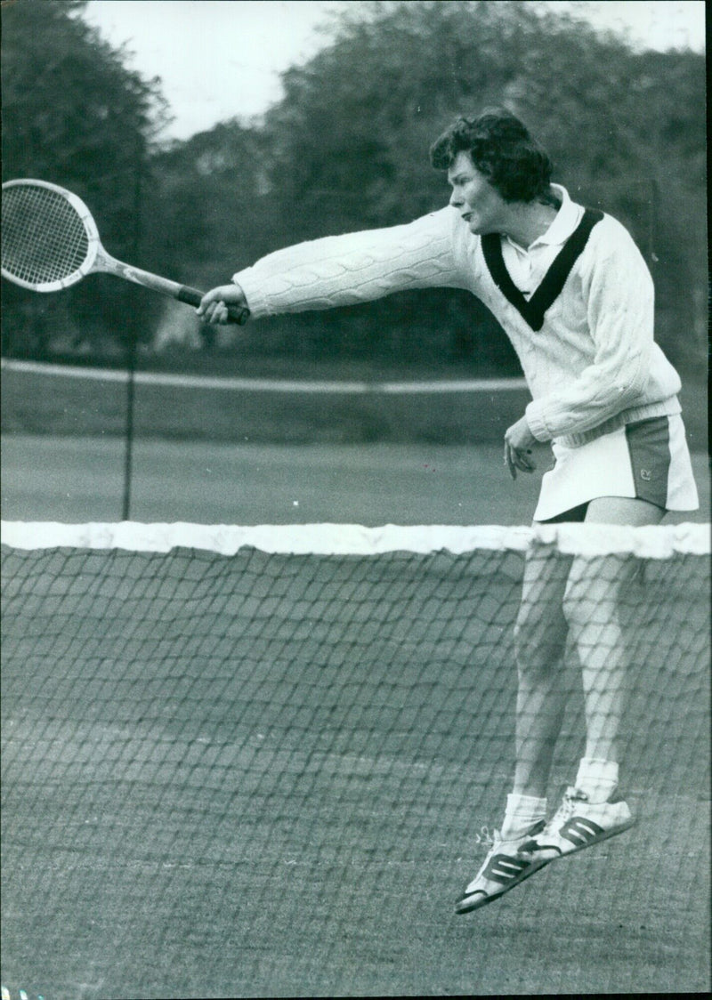 Oxford University women's tennis captain Ann Russell in a doubles match at the Varsity match against Cambridge in the Parks on Saturday. - Vintage Photograph