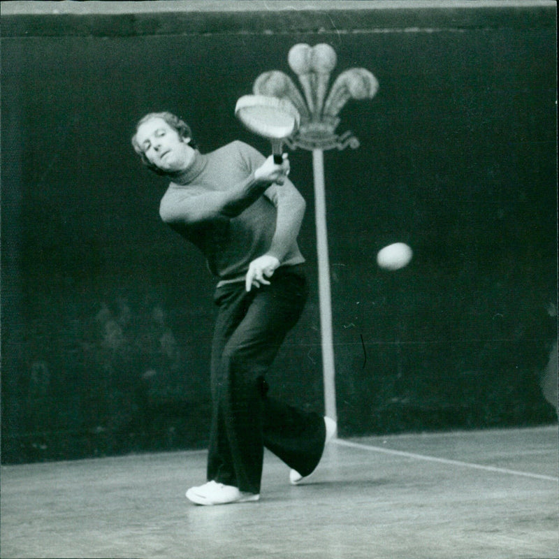 Tennis players, with their backs to the camera, competing in a match. - Vintage Photograph