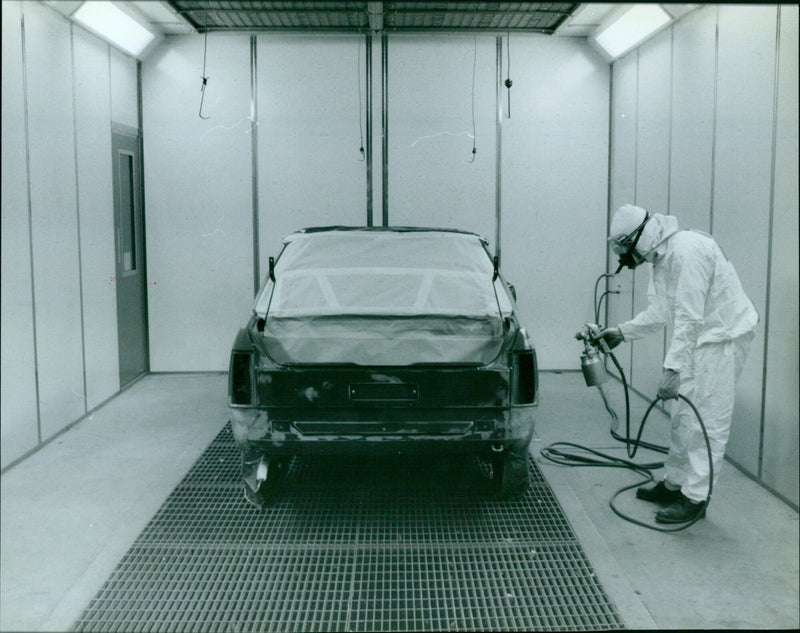 Kenny Taylor spraying inside the City Motors spray booth. - Vintage Photograph