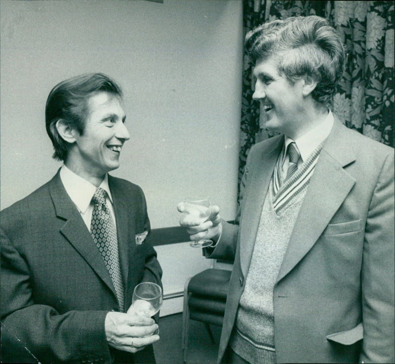 Brian Turbul and Ivan Clarke share a drink before the dinner. - Vintage Photograph