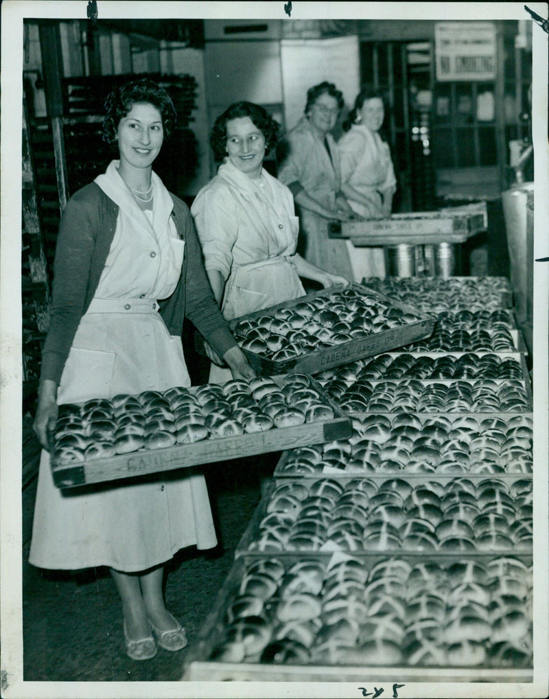 Miss S. Belche prepares cross buns at the La Cadena Cafes ITO 245 & Cutrelce bakery. - Vintage Photograph