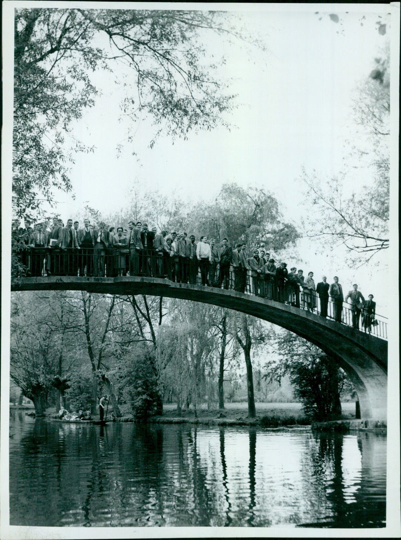 Thousands of spectators gather for a tug of war match at St. Peters Hall. - Vintage Photograph