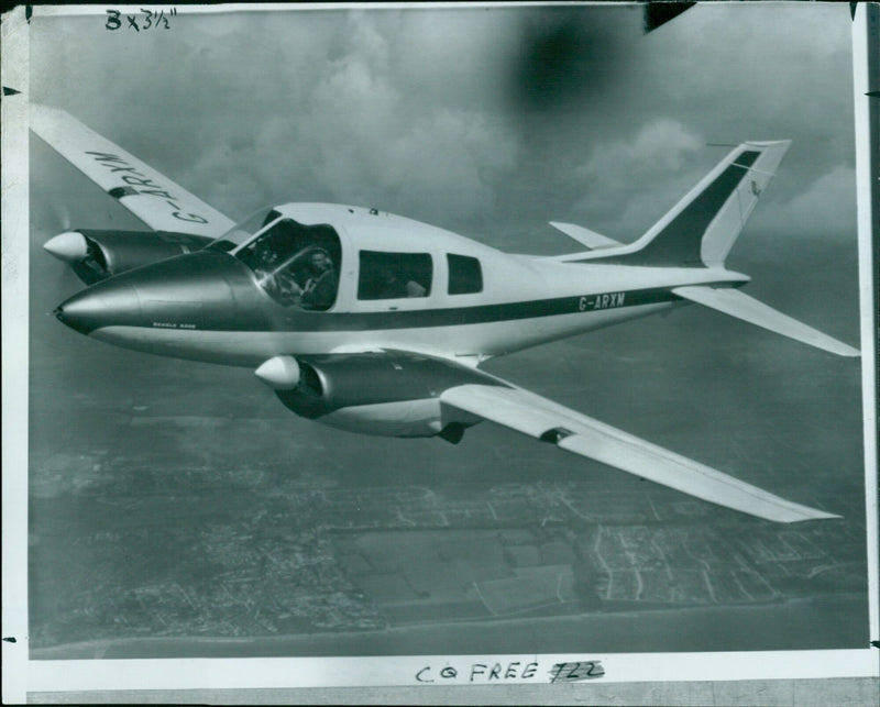 Pilot Fred Brown (right) and co-pilot John Smith (left) prepare to take off in a G-ARXM CO aircraft. - Vintage Photograph