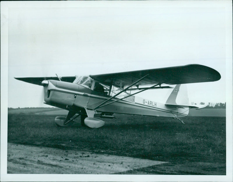 A Beagle A.61 Terrier aircraft is seen on the runway, demonstrating its reliability, versatility, and quiet cruising capability. - Vintage Photograph