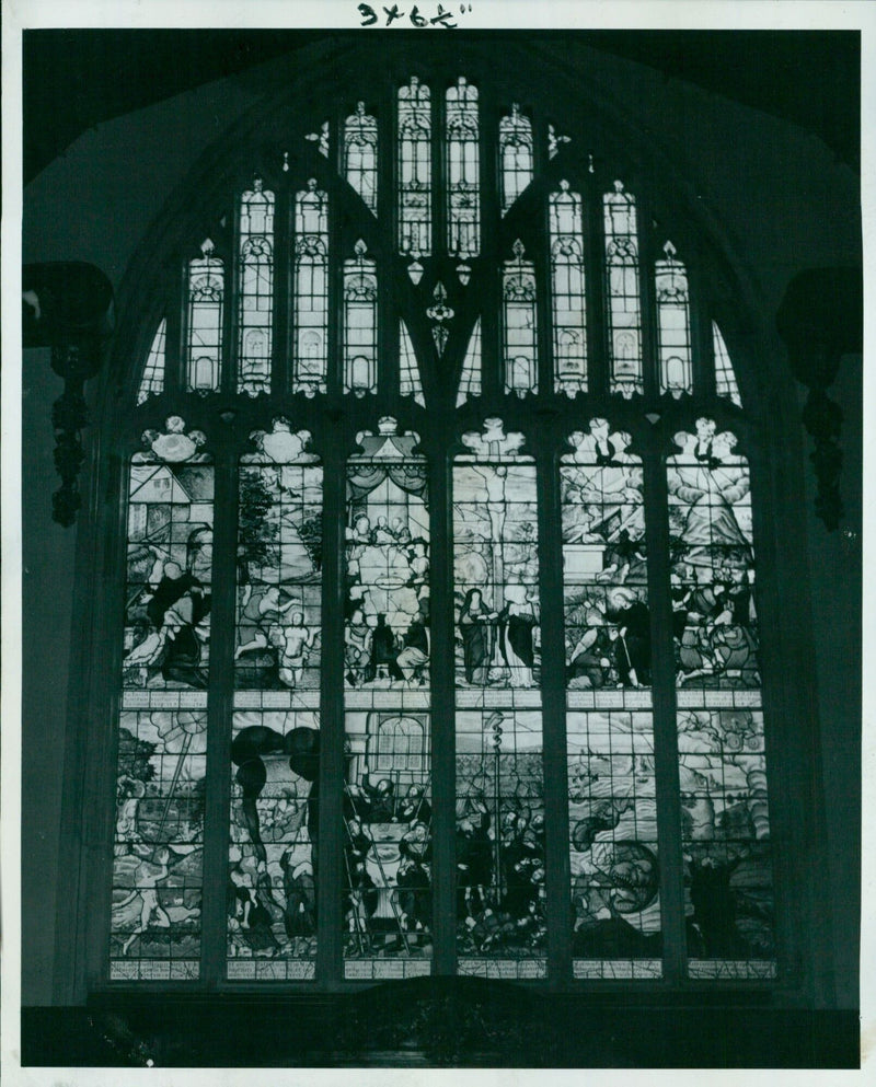 The 17th-century east window of Lincoln College Chapel in Oxford, England, is back in its place after three years of cleaning and restoration. - Vintage Photograph